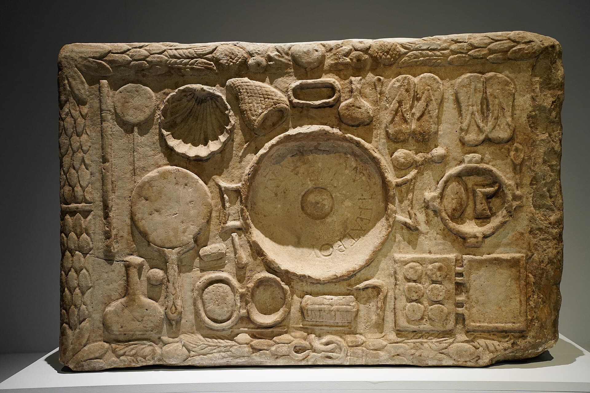 A votive marble panel dedicated to Demeter by the priestess Claudia Ageta, carved around 170 CE.