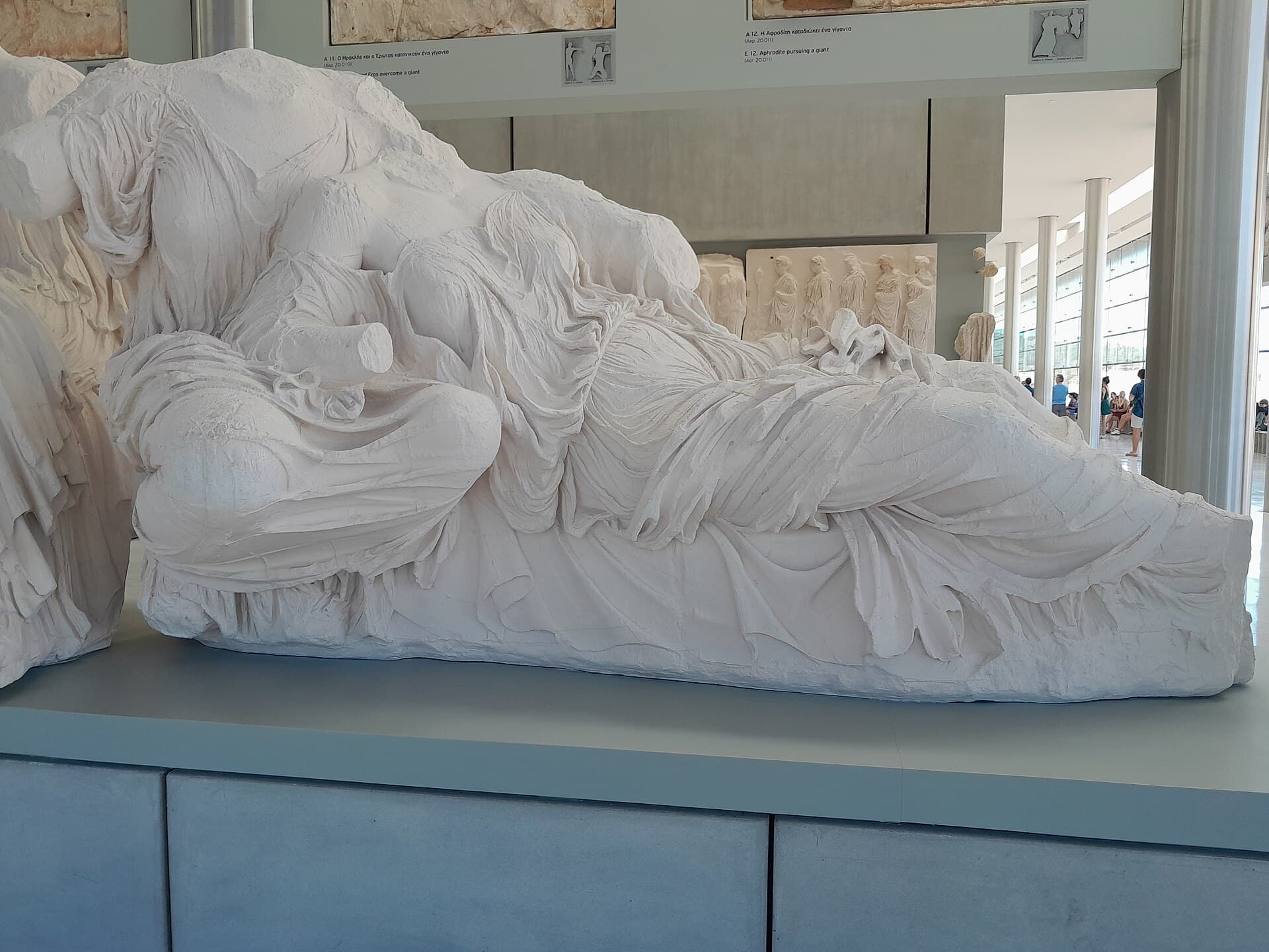 A plaster cast of the two reclining goddesses from the east pediment of the Parthenon, identified as Dione and Aphrodite.