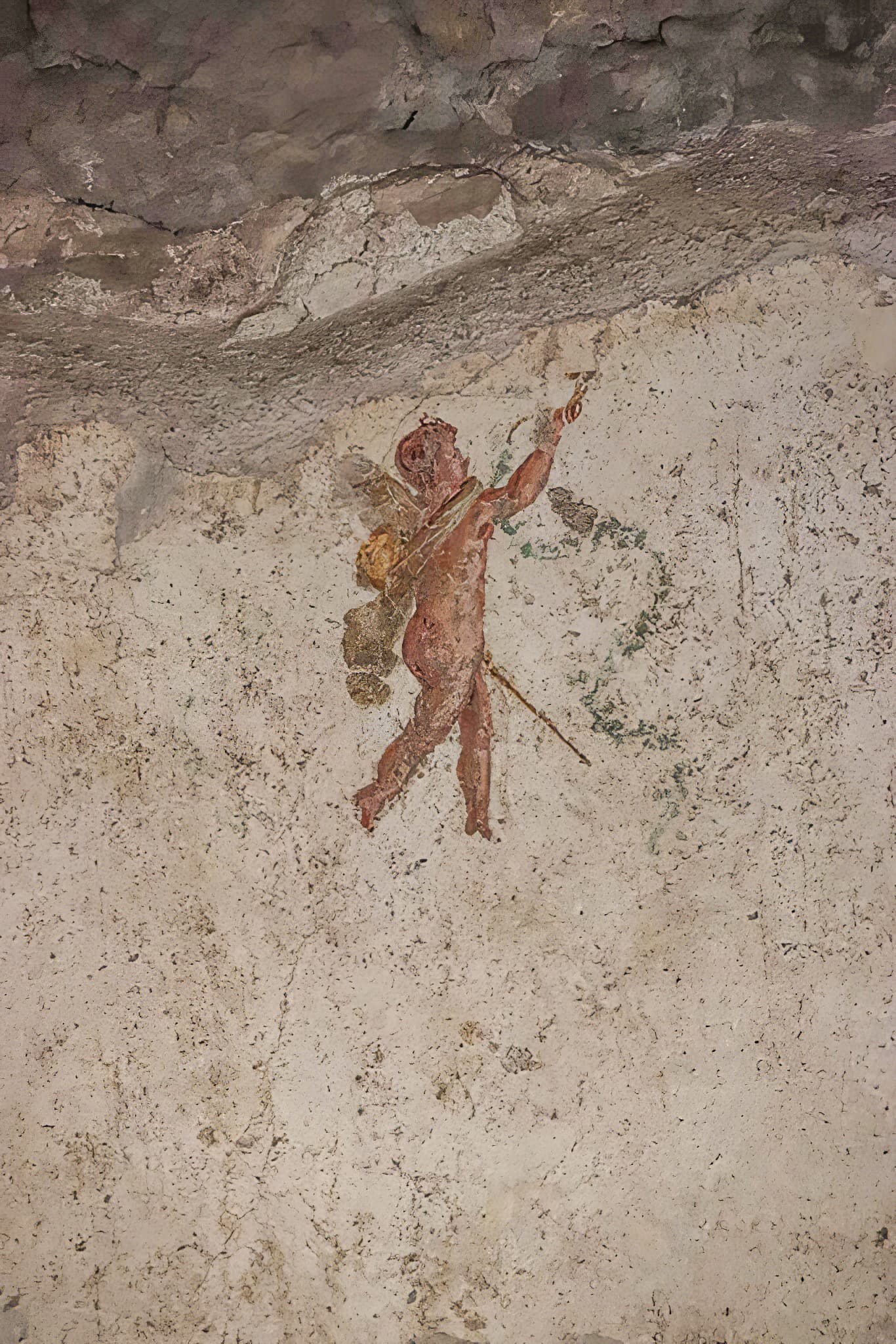 A painted figure of a cupid from the south wall of a bedroom in the House of the Vettii at Pompeii.
