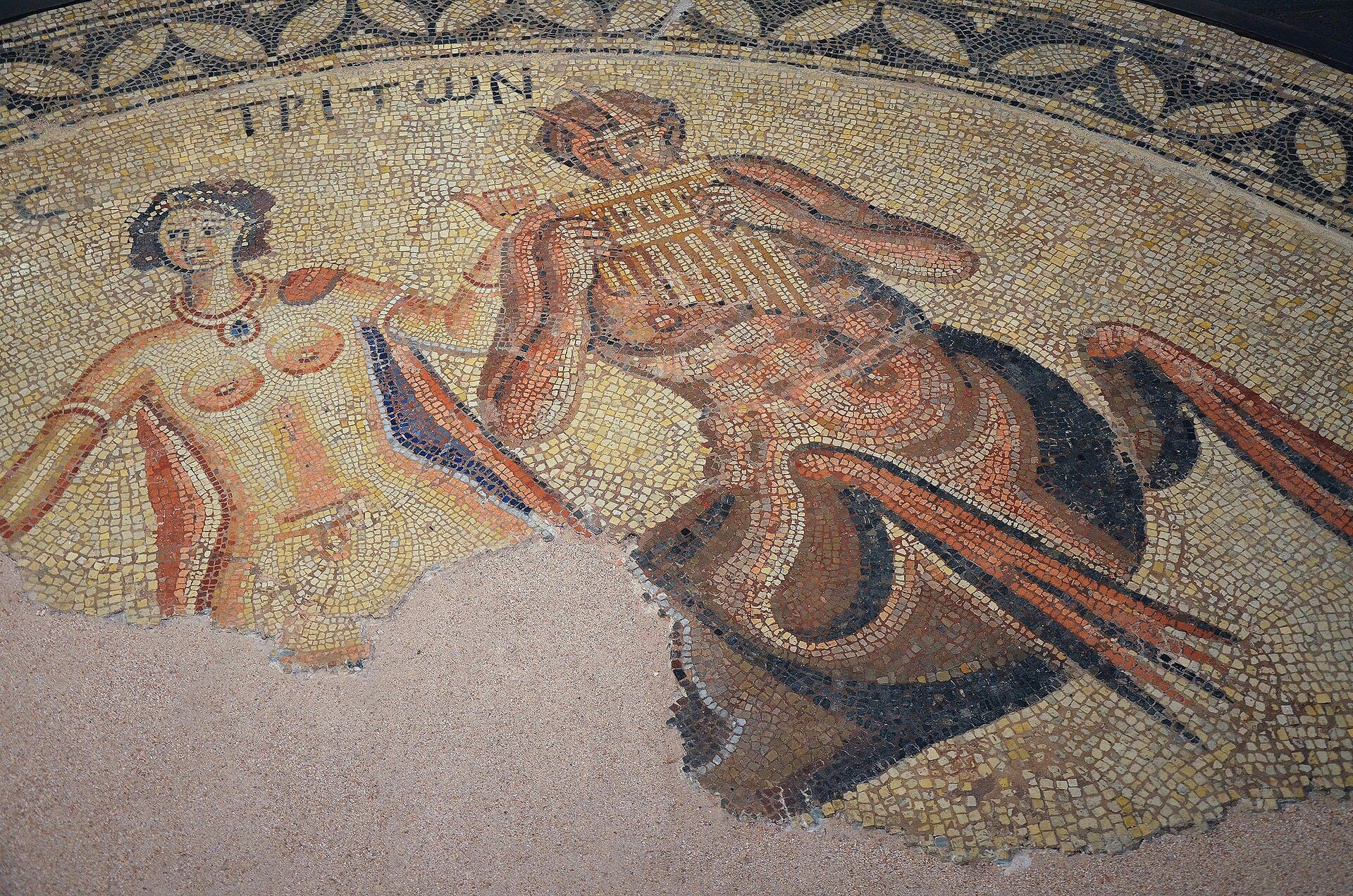 A Roman floor mosaic showing the Nereid Thetis accompanied by a Triton playing pipes, from the villa at Saint-Rustice.